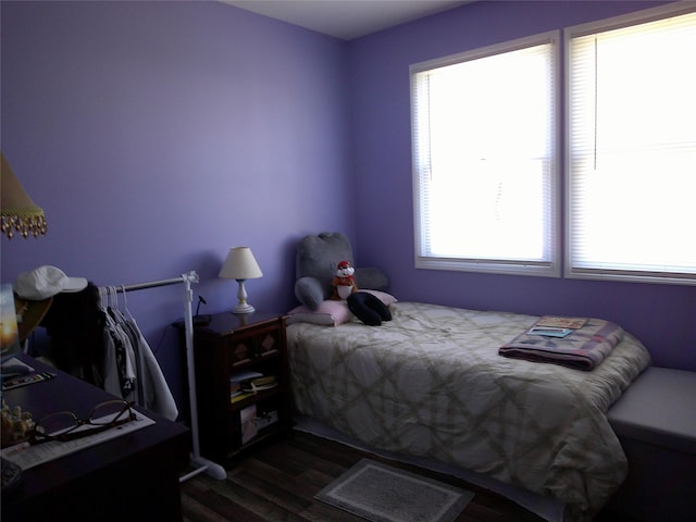 bedroom with wood finished floors