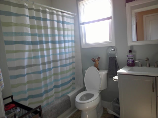 bathroom with toilet, shower / tub combo, and vanity