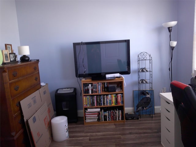 office area featuring baseboards and wood finished floors