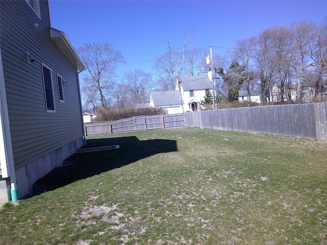 view of yard with a fenced backyard