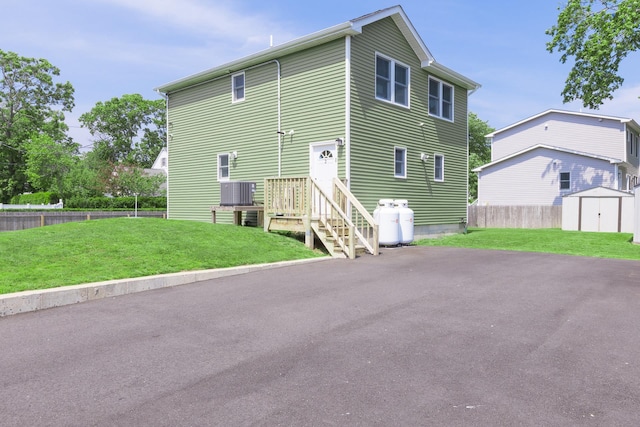 2 Lafayette Dr, Shirley, NY 11967 - rear view of property with a storage shed
