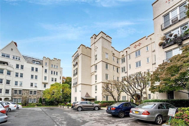 view of property featuring uncovered parking