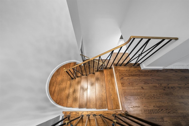stairs with wood finished floors