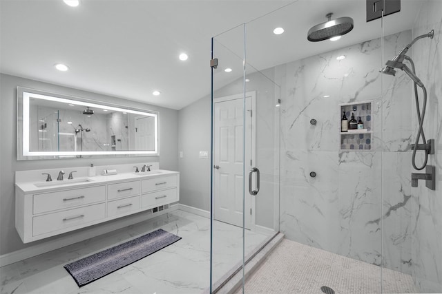 full bath with marble finish floor, a marble finish shower, and a sink