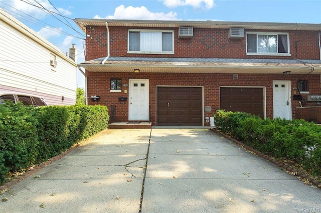 206-38 45th Rd, Bayside, NY 11361 - multi unit property with a garage, driveway, and brick siding