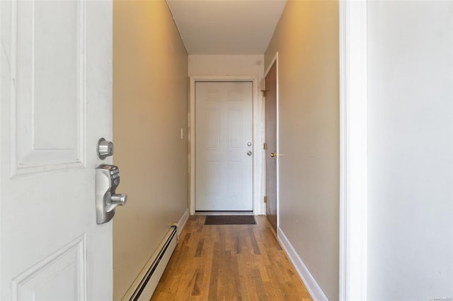 206-38 45th Rd, Bayside, NY 11361 - entryway with a baseboard heating unit, baseboards, and wood finished floors