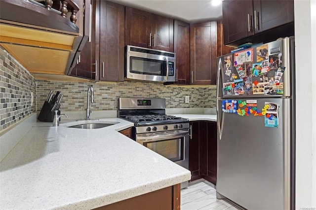 206-38 45th Rd, Bayside, NY 11361 - kitchen with tasteful backsplash, dark brown cabinets, a sink, stainless steel appliances, and light stone countertops
