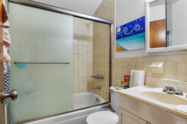 206-38 45th Rd, Bayside, NY 11361 - full bathroom with bath / shower combo with glass door, toilet, tile walls, backsplash, and vanity