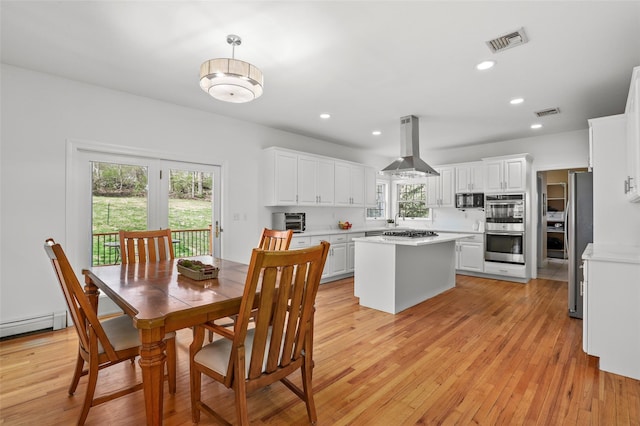 dining space featuring recessed lighting, light wood-style floors, and visible vents