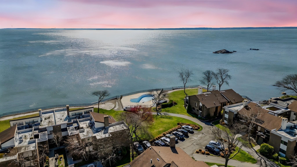 drone / aerial view with a water view and a residential view