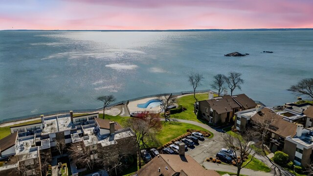 drone / aerial view with a water view and a residential view