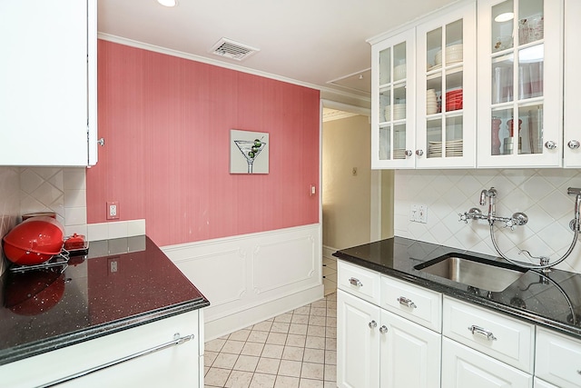 45 Holiday Blvd, Center Moriches, NY 11934 - kitchen featuring ornamental molding, white cabinets, a sink, decorative backsplash, and glass insert cabinets
