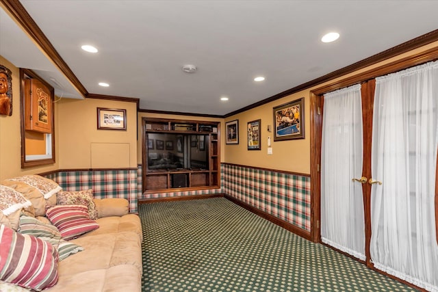 carpeted living room with ornamental molding, recessed lighting, and a wainscoted wall