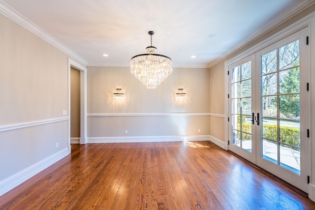 11 Victorian Ln, Brookville, NY 11545 - spare room with wood finished floors, crown molding, a chandelier, french doors, and recessed lighting