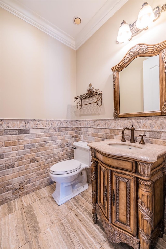 11 Victorian Ln, Brookville, NY 11545 - bathroom featuring vanity, crown molding, wainscoting, and tile walls