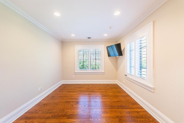 11 Victorian Ln, Brookville, NY 11545 - empty room with healthy amount of natural light, wood finished floors, ornamental molding, and recessed lighting