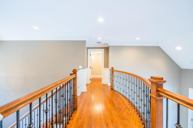 11 Victorian Ln, Brookville, NY 11545 - hallway featuring an upstairs landing, light wood-style floors, recessed lighting, crown molding, and wainscoting