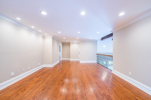 11 Victorian Ln, Brookville, NY 11545 - unfurnished room with crown molding, light wood-style flooring, and recessed lighting
