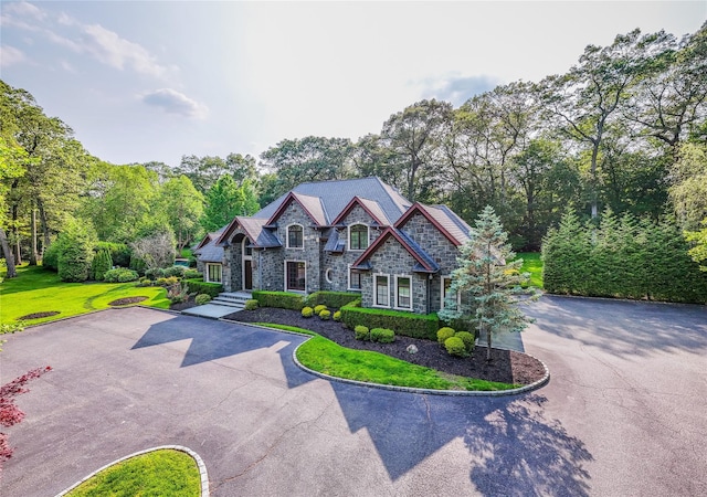 11 Victorian Ln, Brookville, NY 11545 - view of front of home with stone siding and driveway