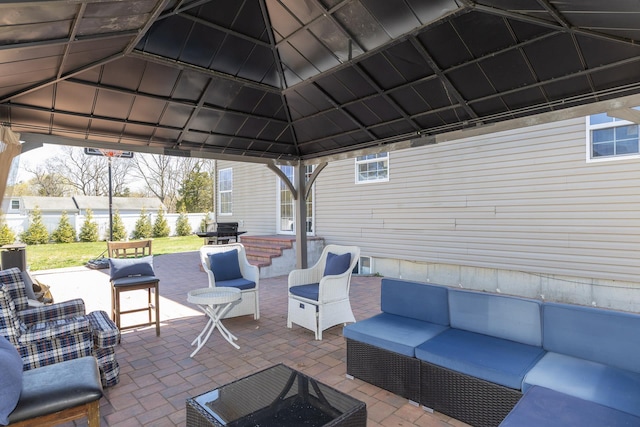 view of patio featuring a gazebo and an outdoor hangout area