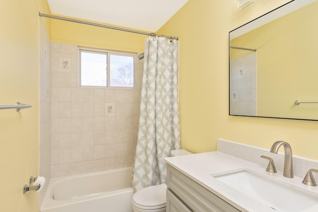 bathroom featuring shower / tub combo, toilet, and vanity