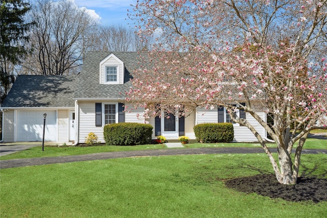 950 Main Bayview Rd, Southold, NY 11971 - view of front of property with roof with shingles, driveway, an attached garage, and a front lawn