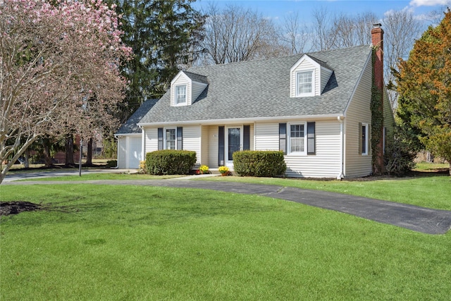 950 Main Bayview Rd, Southold, NY 11971 - cape cod home with roof with shingles, a chimney, driveway, and a front lawn