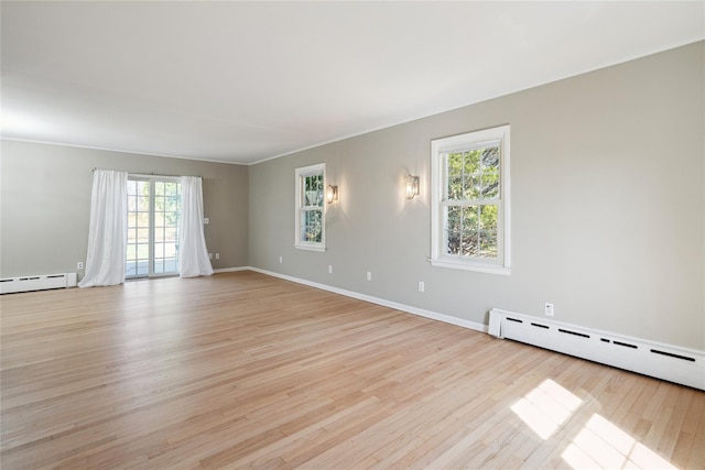 950 Main Bayview Rd, Southold, NY 11971 - unfurnished room with baseboards, light wood-type flooring, and baseboard heating