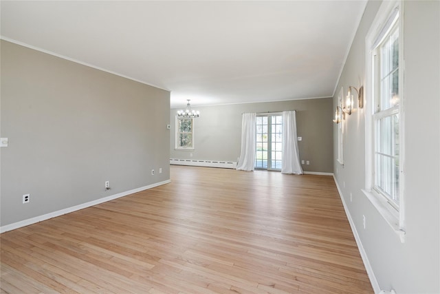 950 Main Bayview Rd, Southold, NY 11971 - unfurnished room with ornamental molding, a chandelier, a baseboard radiator, light wood finished floors, and baseboards