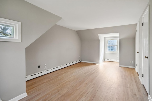 950 Main Bayview Rd, Southold, NY 11971 - additional living space featuring baseboards, light wood finished floors, a baseboard heating unit, and lofted ceiling