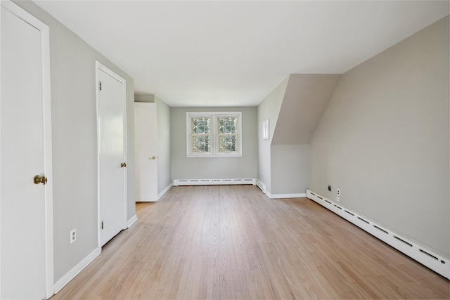 950 Main Bayview Rd, Southold, NY 11971 - additional living space featuring a baseboard radiator, light wood-type flooring, and baseboards
