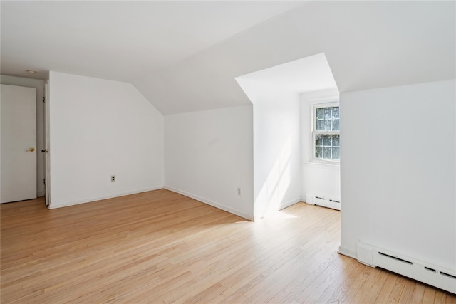 950 Main Bayview Rd, Southold, NY 11971 - bonus room with baseboards, light wood-type flooring, lofted ceiling, and baseboard heating