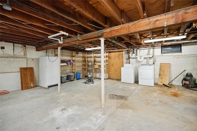 950 Main Bayview Rd, Southold, NY 11971 - unfinished basement with concrete block wall and washer and clothes dryer