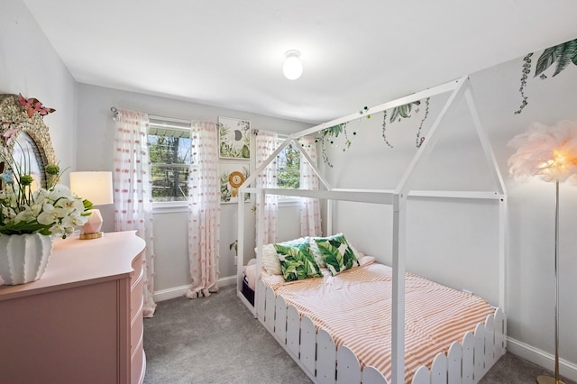 bedroom featuring baseboards and light colored carpet