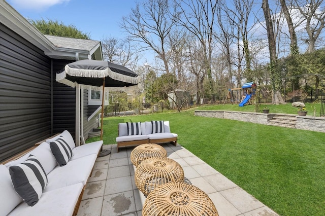view of yard featuring an outdoor hangout area, a patio area, a playground, and fence