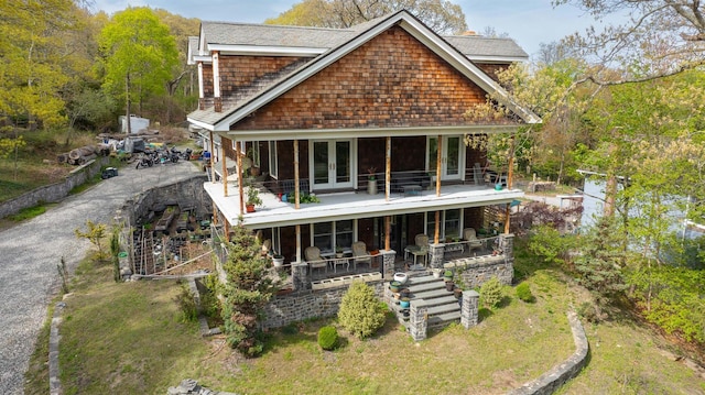 rear view of house featuring french doors