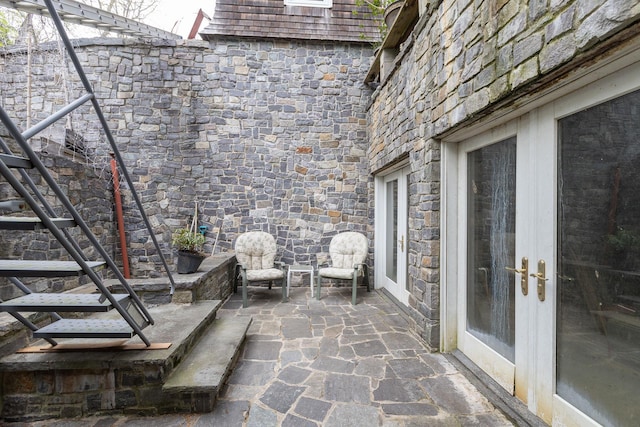 view of patio featuring french doors and stairs