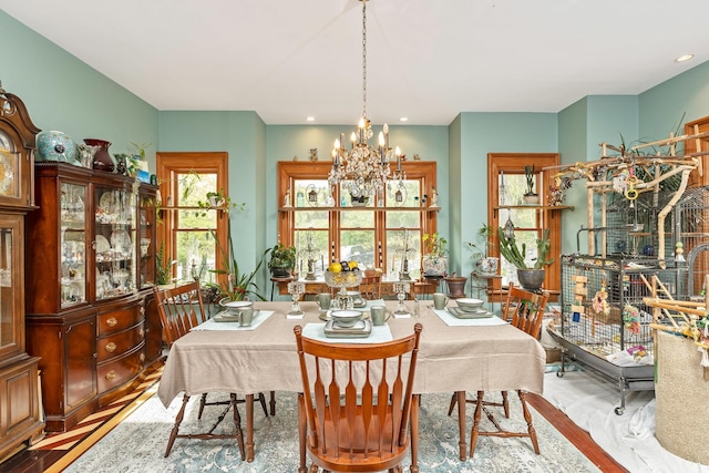 dining area with recessed lighting and a notable chandelier