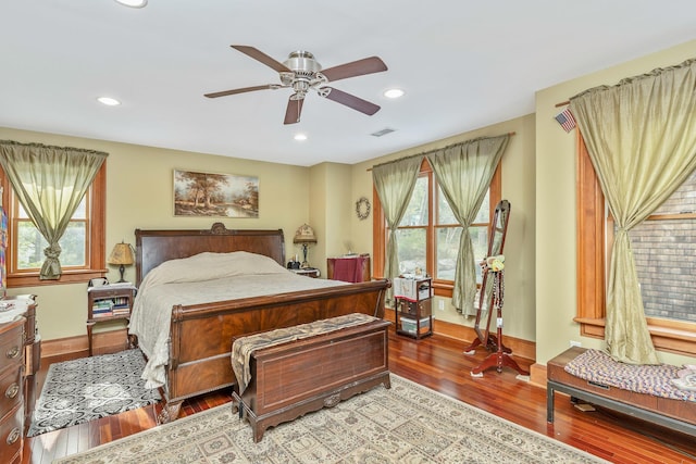 bedroom featuring recessed lighting, baseboards, hardwood / wood-style flooring, and visible vents