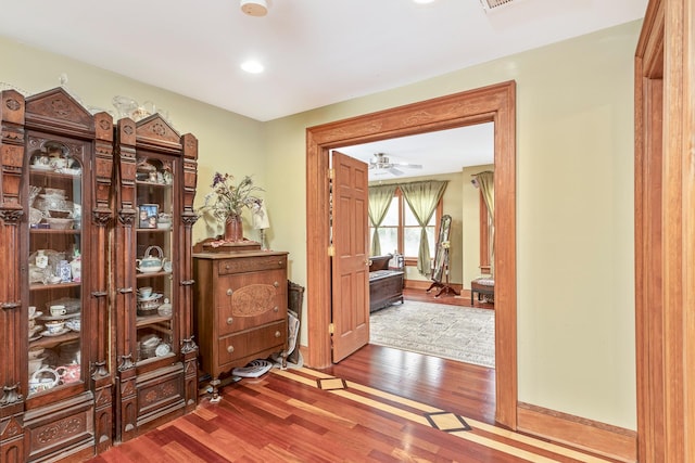 corridor with recessed lighting and wood finished floors