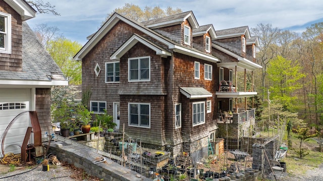 view of side of property with a balcony