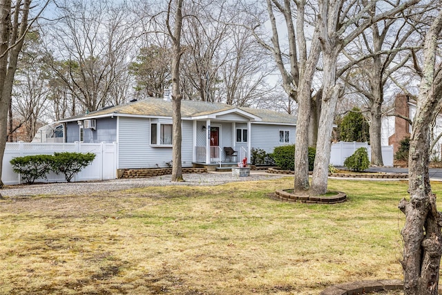 431 Grand Blvd, Brentwood, NY 11717 - ranch-style home with fence, a shingled roof, and a front lawn