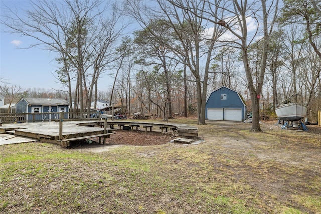 431 Grand Blvd, Brentwood, NY 11717 - view of yard with an outbuilding, a detached garage, and a deck