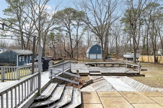 431 Grand Blvd, Brentwood, NY 11717 - deck with an outdoor structure, a storage shed, and fence