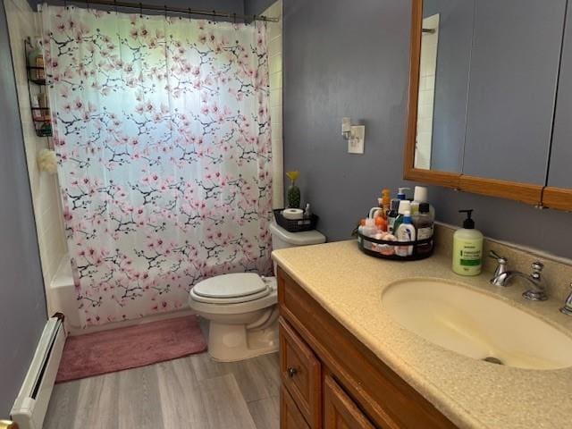 27 Hampton Ave, Mastic, NY 11950 - full bath with a baseboard heating unit, toilet, wood finished floors, vanity, and shower / tub combo with curtain