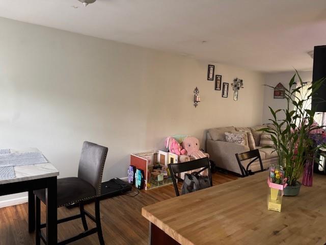 27 Hampton Ave, Mastic, NY 11950 - dining space with dark wood-style floors