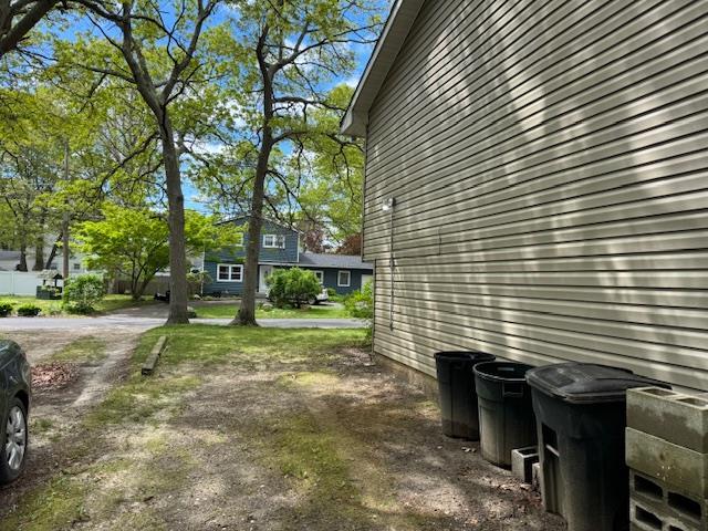 27 Hampton Ave, Mastic, NY 11950 - view of side of home