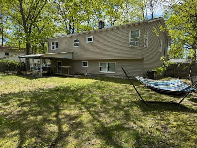27 Hampton Ave, Mastic, NY 11950 - back of house featuring a chimney