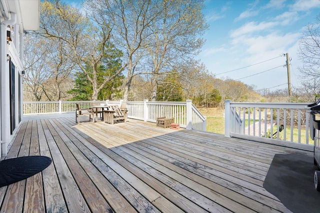 deck featuring outdoor dining area