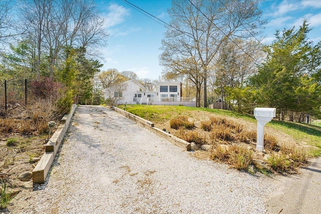 view of front of home with gravel driveway